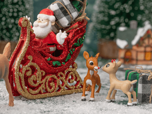 A collection of classic Christmas animation characters displayed in a festive scene.