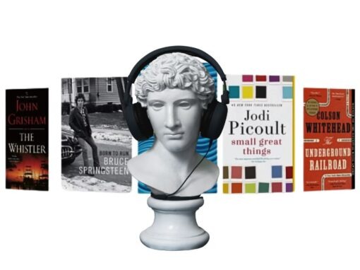 Head carved in stone wearing headphones with array of book covers in the background