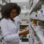 Phemale pharmacist collecting prescriptions