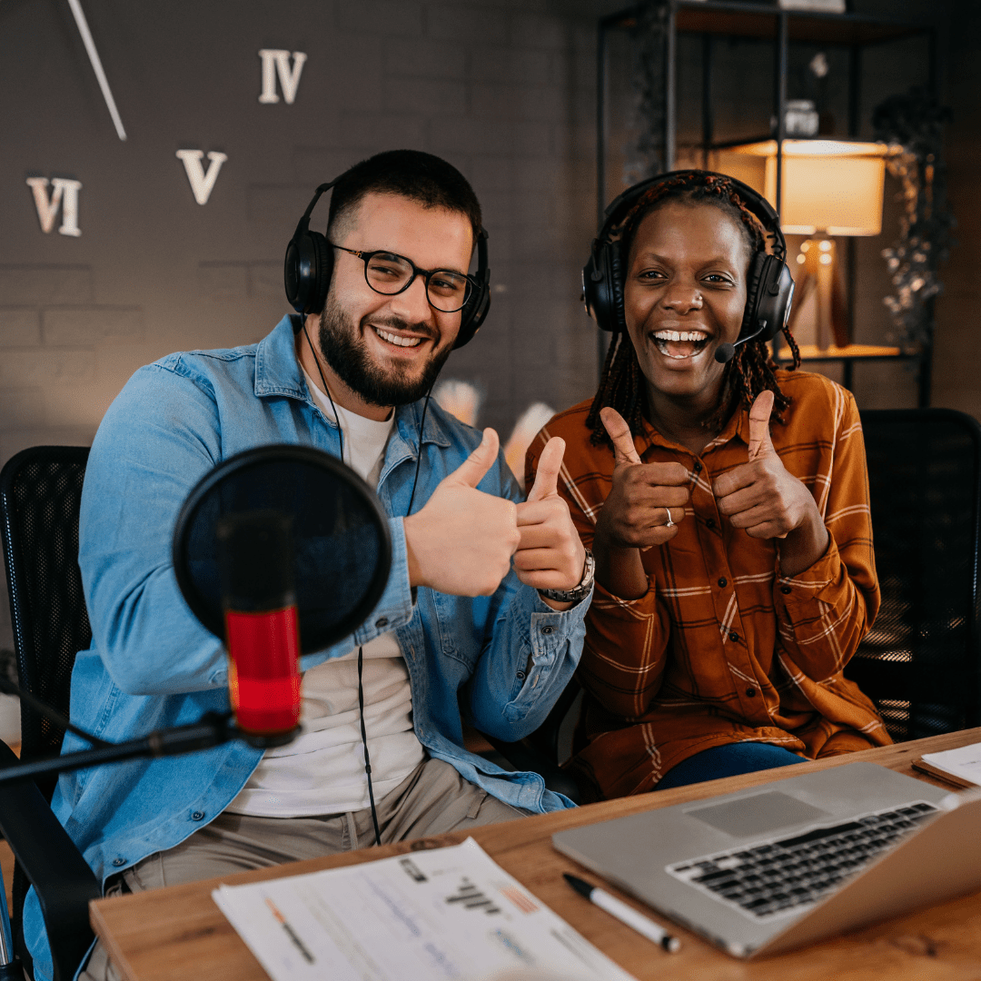 Happy podcasters giving a thumbs up