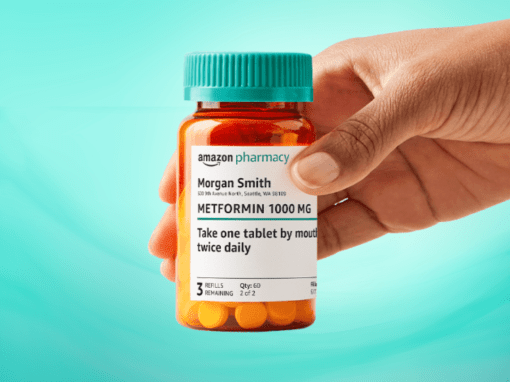 Hand holding a prescription bottle provided by Amazon Pharmacy.
