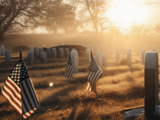 A fog-covered military cemetery at dawn with gravestones and American flags casting long shadows, symbolizing the solemn sacrifice honored on Memorial Day.